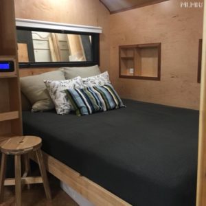 Bed in a Tiny Travel Trailer Home