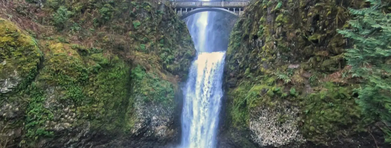 Waterfall flowing under a bridge atMultnomah Falls